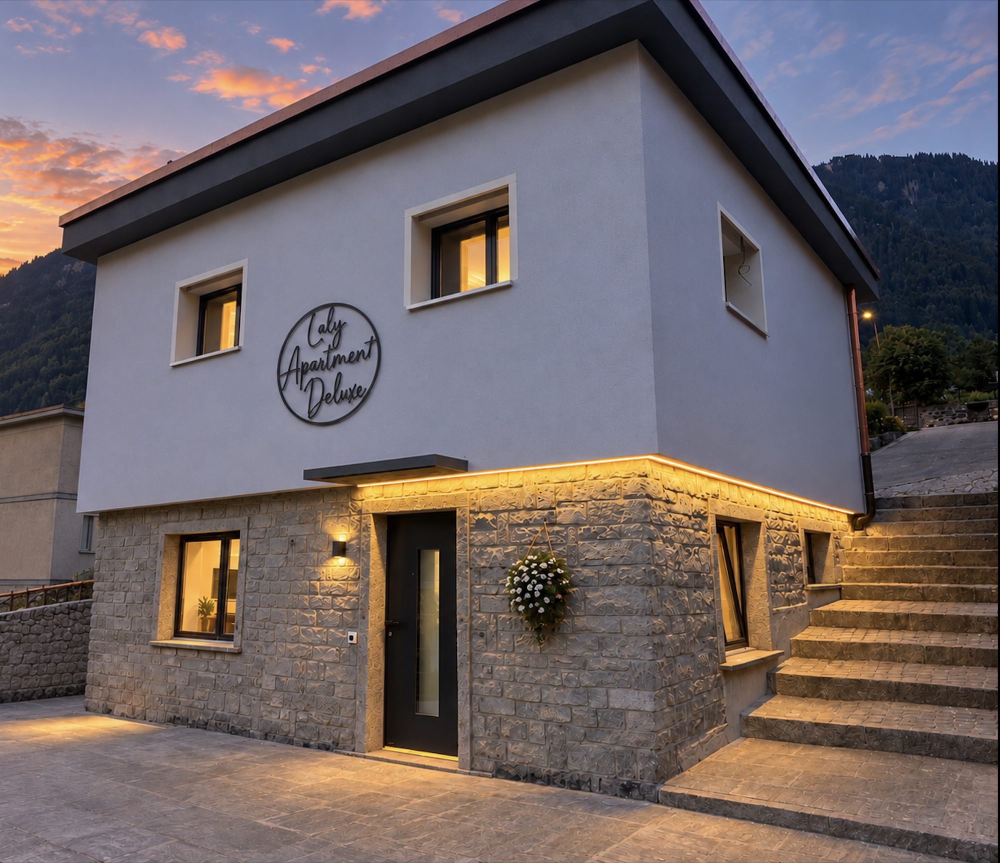 Apartment Deluxe al tramonto: casa indipendente in pietra e intonaco ad Airolo, con le montagne sullo sfondo